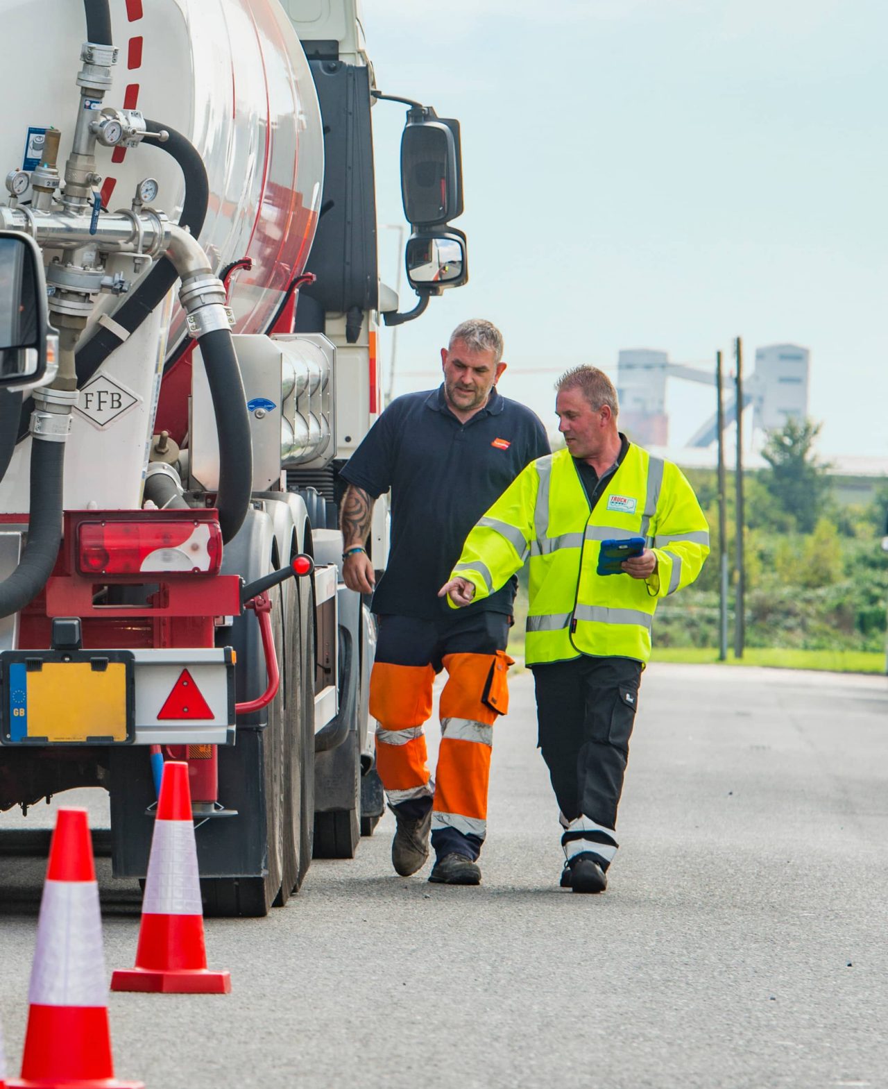 Goodyear Truckforce expert walking alongside truck driver for road-side assistance